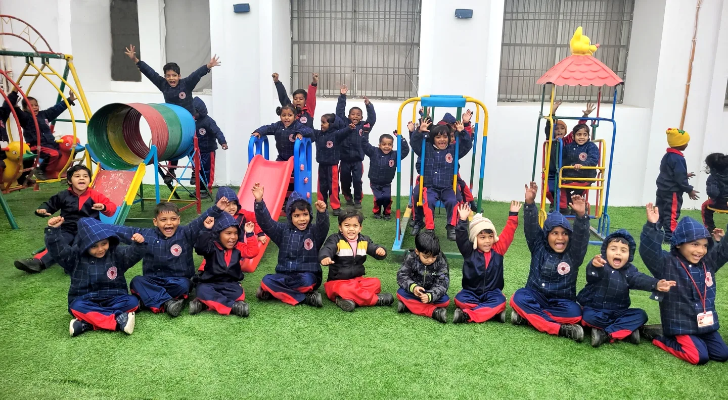 Happy students enjoying the playground at Red Rose Public School