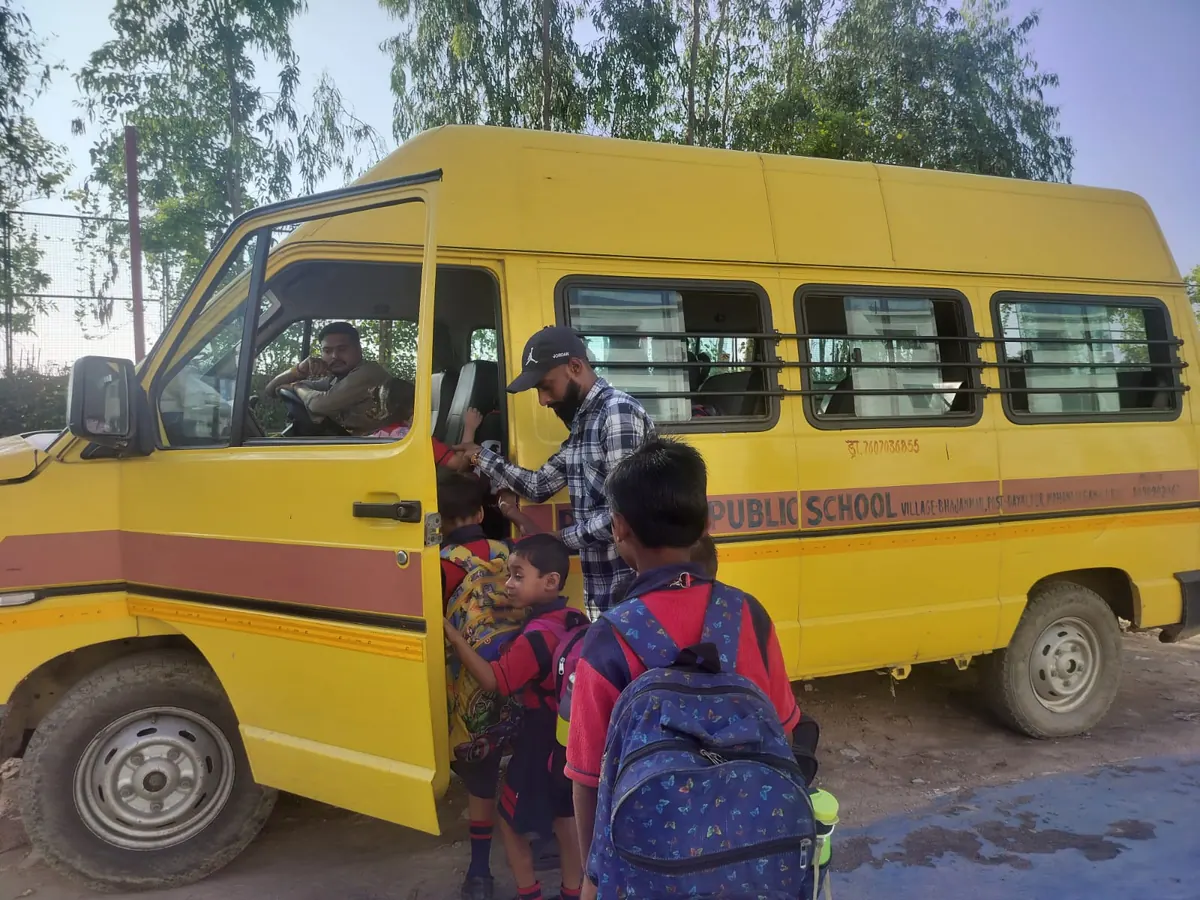 Attendant helping students